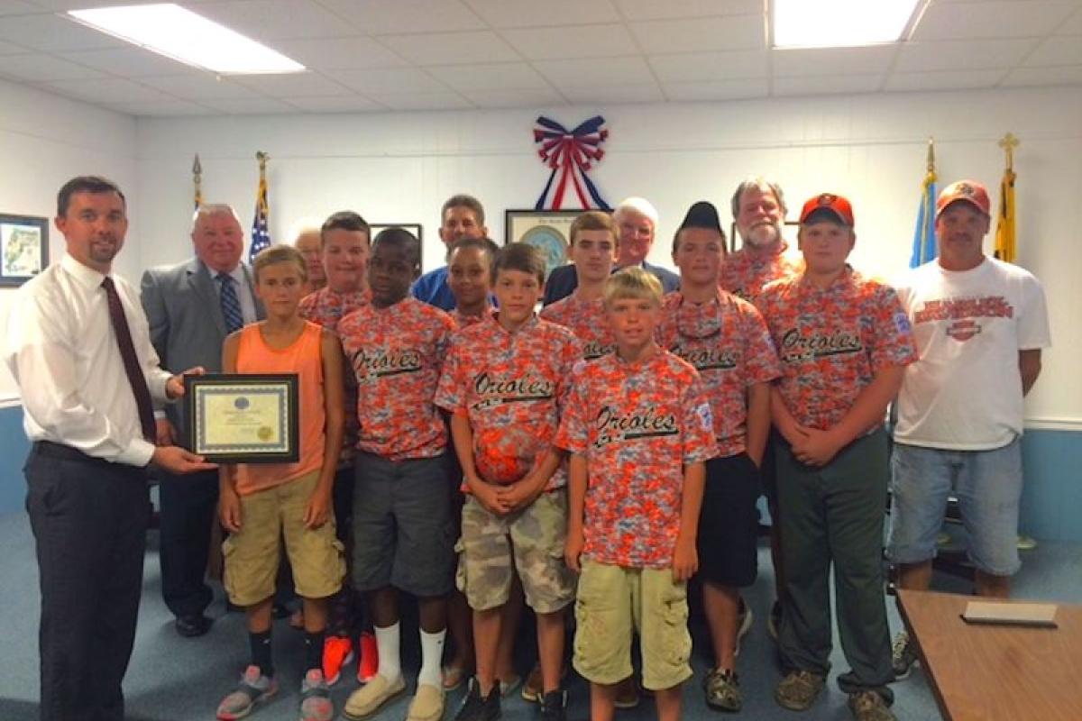 The Rock Hall Mayor and Council presented the Rock Hall Orioles, the town’s Kent County Youth Intermediate Division baseball team, with this month’s Rock Hall Community Spirit Award Thursday, Aug. 13, during the town council meeting. The award was given to the team for winning the best of three championship series. PHOTO BY DORIAN MITCHELL 