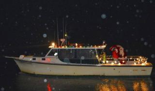 Santa arrives in the Rock Hall Harbor by boat